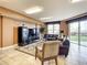 Common area with leather sofas and a large TV at 2403 S Atlantic Ave # 409, Daytona Beach Shores, FL 32118