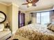 Main bedroom with king bed and large windows offering natural light at 2403 S Atlantic Ave # 409, Daytona Beach Shores, FL 32118