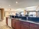 Community kitchen features granite countertops, wood cabinets, and stainless steel appliances at 2403 S Atlantic Ave # 409, Daytona Beach Shores, FL 32118