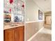 Home bar with granite countertop and storage at 2403 S Atlantic Ave # 409, Daytona Beach Shores, FL 32118
