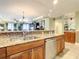 Kitchen with granite countertops, stainless steel appliances, and wood cabinets at 2403 S Atlantic Ave # 409, Daytona Beach Shores, FL 32118