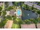 Aerial view of community pool and lake at 6462 Cantua Ln # 107, Orlando, FL 32835