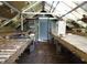 Greenhouse with workbenches and space for plants and gardening supplies at 207 E 2Nd Ave, Pierson, FL 32180