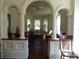 Living room with decorative columns and hardwood floors at 207 E 2Nd Ave, Pierson, FL 32180