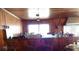 Simple bar area with wood bar and four wooden chairs at 207 E 2Nd Ave, Pierson, FL 32180