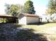 White outbuilding with rusty metal roof at 207 E 2Nd Ave, Pierson, FL 32180