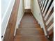 Wooden staircase connecting the floors of the house at 207 E 2Nd Ave, Pierson, FL 32180