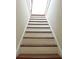 Classic wooden staircase leading to the upper level of the home at 207 E 2Nd Ave, Pierson, FL 32180