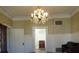 Formal dining room featuring a chandelier and vintage furniture at 207 E 2Nd Ave, Pierson, FL 32180