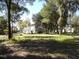 Charming one-story house nestled among lush trees at 207 E 2Nd Ave, Pierson, FL 32180