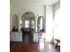 Living room with hardwood floors and arched doorways at 207 E 2Nd Ave, Pierson, FL 32180