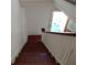 Wooden staircase with white railing and hardwood steps at 207 E 2Nd Ave, Pierson, FL 32180