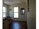 Bright hallway with hardwood floors and large windows at 207 E 2Nd Ave, Pierson, FL 32180