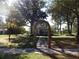Two-story house exterior with an archway entrance at 207 E 2Nd Ave, Pierson, FL 32180