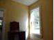 Simple bedroom with a window, desk and shelving unit at 207 E 2Nd Ave, Pierson, FL 32180
