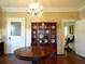 Formal dining room featuring hardwood floors, a chandelier, and built-in hutch at 207 E 2Nd Ave, Pierson, FL 32180