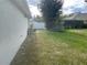 Landscaped backyard with grassy area at 6131 Sabal Point Cir, Port Orange, FL 32128