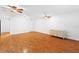Spacious bedroom with hardwood floors and ceiling fans at 5994 Seminole Woods Dr, Port Orange, FL 32127