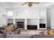 Living room boasts a fireplace and built-in shelving at 5994 Seminole Woods Dr, Port Orange, FL 32127