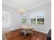 Elegant dining room with hardwood floors and chandelier at 5994 Seminole Woods Dr, Port Orange, FL 32127