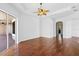 Spacious living room with hardwood floors and sliding glass doors at 5994 Seminole Woods Dr, Port Orange, FL 32127