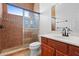 Clean bathroom with shower and wood vanity at 5994 Seminole Woods Dr, Port Orange, FL 32127