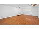 Large bedroom with hardwood floors and ceiling fans at 5994 Seminole Woods Dr, Port Orange, FL 32127