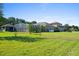 Large backyard with a pool and screened enclosure at 5994 Seminole Woods Dr, Port Orange, FL 32127