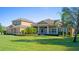 House exterior showcasing landscaping and architectural details at 5994 Seminole Woods Dr, Port Orange, FL 32127