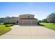 Three-car garage and large driveway at 5994 Seminole Woods Dr, Port Orange, FL 32127