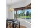 Breakfast nook with pool and patio view at 5994 Seminole Woods Dr, Port Orange, FL 32127