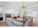 Open living room with sectional sofa and fireplace at 5994 Seminole Woods Dr, Port Orange, FL 32127