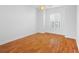 Hardwood floor bedroom with window and ceiling fan at 5994 Seminole Woods Dr, Port Orange, FL 32127