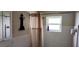 Simple bathroom with shower stall and window at 1628 Paradise Ln, Astor, FL 32102