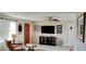 Cozy living room featuring comfortable seating and a large TV at 1628 Paradise Ln, Astor, FL 32102