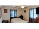 Charming bedroom with twin bed and plaid curtains at 1628 Paradise Ln, Astor, FL 32102