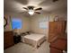 Spacious bedroom with double bed and wood furniture at 1628 Paradise Ln, Astor, FL 32102