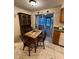Cozy dining area with wood table and chairs near kitchen at 1628 Paradise Ln, Astor, FL 32102