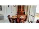 Cozy dining area with wooden table and chairs near sliding door at 1628 Paradise Ln, Astor, FL 32102