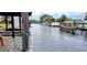 Scenic view of a canal with waterfront homes and lush greenery at 1628 Paradise Ln, Astor, FL 32102