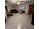 Spacious living room with tiled floors and ample seating at 1628 Paradise Ln, Astor, FL 32102