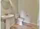 Small half bathroom with pedestal sink and toilet at 2329 River Ridge Rd # 160, Deland, FL 32720