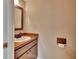 Small half bathroom with a pedestal sink and dark wood vanity at 2329 River Ridge Rd # 160, Deland, FL 32720