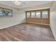 Bright bedroom with large windows and wood-look flooring at 2329 River Ridge Rd # 160, Deland, FL 32720
