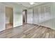 Bright bedroom with wood-look floors, double closets, and an ensuite bathroom at 2329 River Ridge Rd # 160, Deland, FL 32720