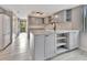 Updated kitchen with gray cabinets, marble countertops, and modern appliances at 2329 River Ridge Rd # 160, Deland, FL 32720