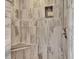 Large walk-in shower with tiled walls and seat at 2329 River Ridge Rd # 160, Deland, FL 32720
