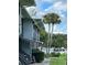 Gray building exterior with walkway and landscaping at 2329 River Ridge Rd # 160, Deland, FL 32720