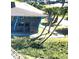 Aerial view of waterfront property with lush landscaping and boat slips at 2329 River Ridge Rd # 160, Deland, FL 32720