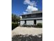 Exterior of building with gravel parking area at 2329 River Ridge Rd # 160, Deland, FL 32720